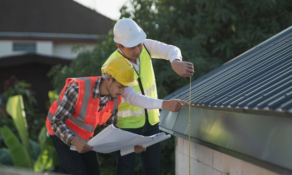 Professional roofer conducting a roof inspection, identifying hidden issues and making repair recommendations.
