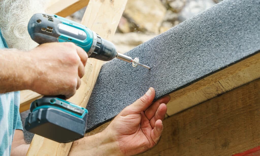 Asphalt shingle repair techniques, including applying roofing cement to fix curling shingles and using sealant to repair cracks, for leak prevention and roof longevity.