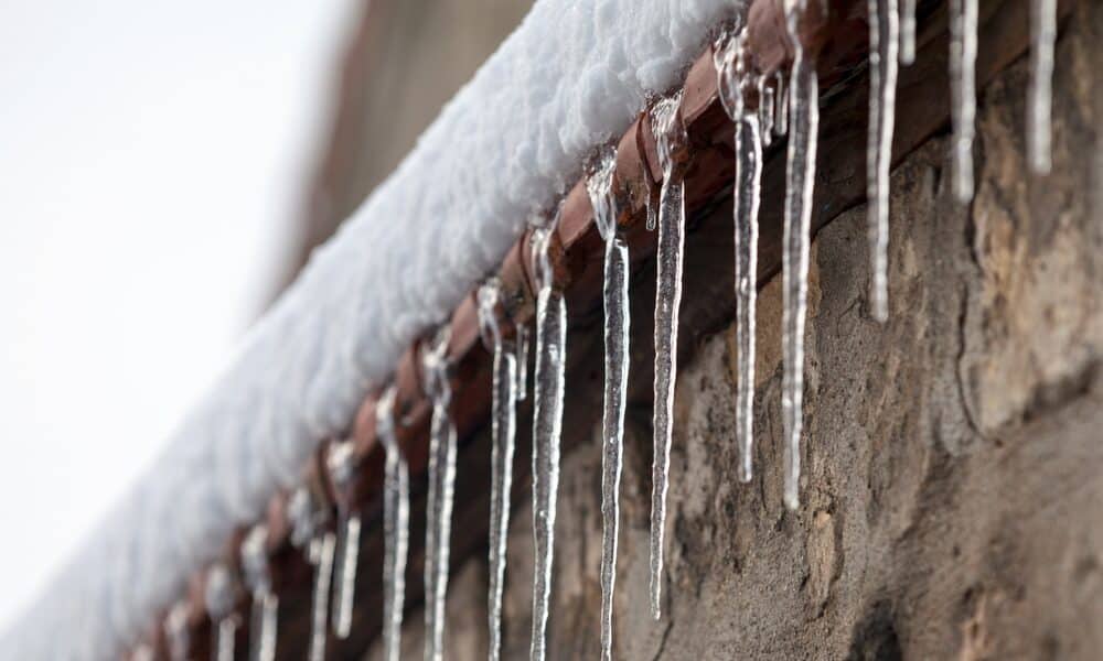 Preventing ice dams with proper insulation, gutter cleaning, and snow removal.
